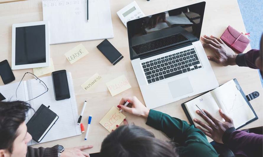 top-view-of-working-desk-with-three-multiethnic-people-working-business-small_4